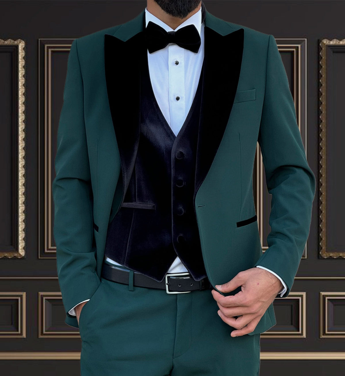 Men's emerald green tuxedo with velvet peak lapel, ideal for weddings and formal events.