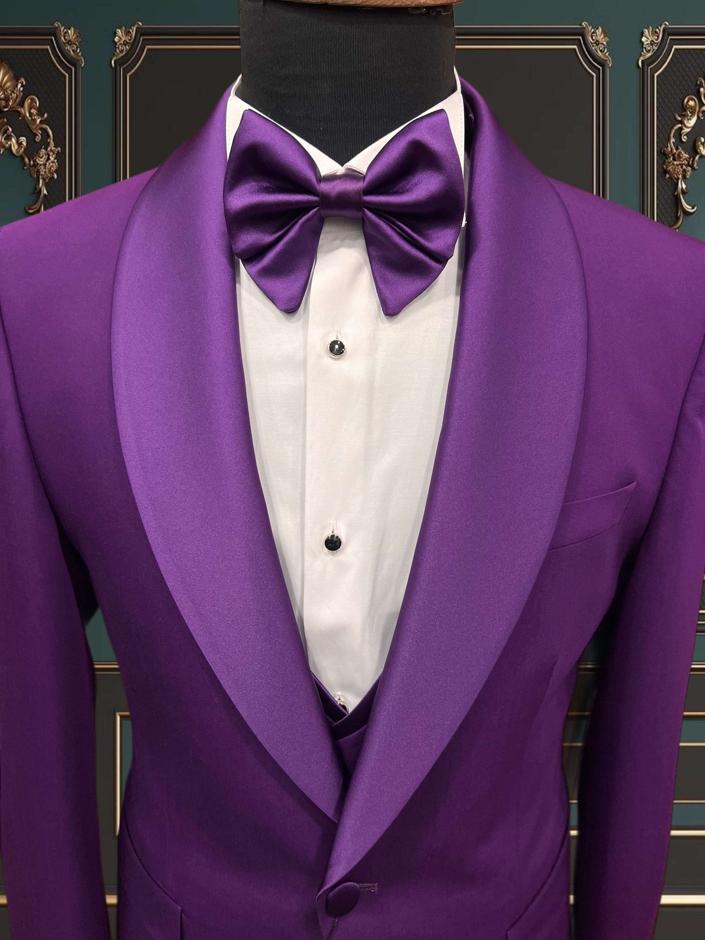 Men's purple shawl lapel tuxedo with bow tie, ideal for weddings and special events.